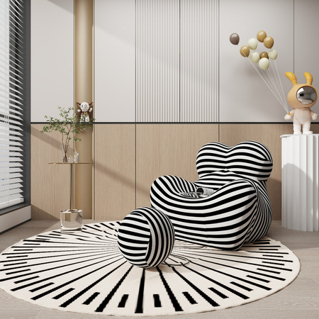 Designerski fotel z podnóżkiem w czarno-białe paski
